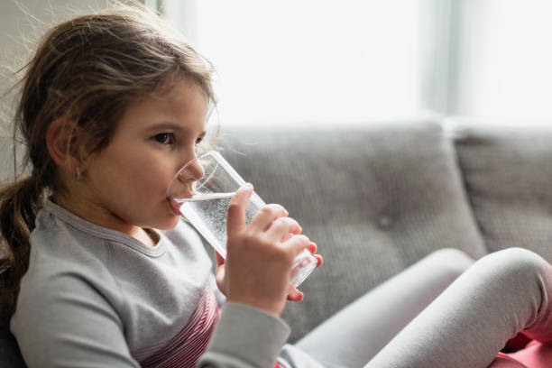 istock Beautiful girl drinking water 1443517875
