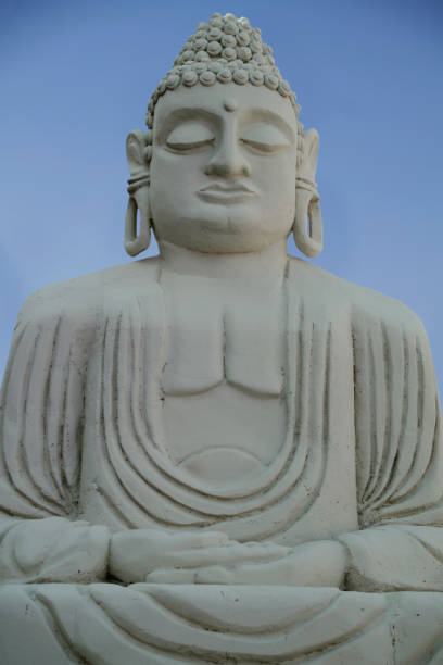 istock Buddha sculpture made of stone on isolated background 1443518914