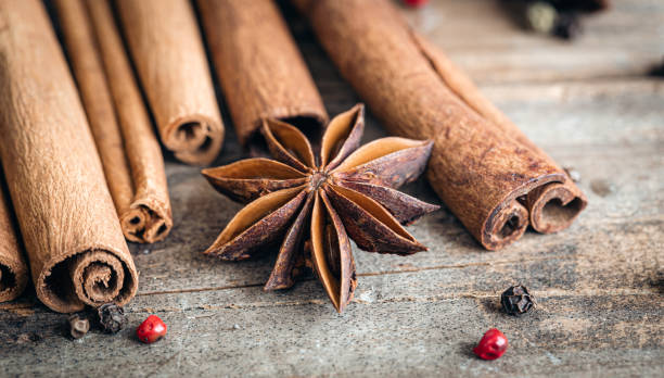 istock Composition with star anise and cinnamon sticks on a wooden background. 1443520134