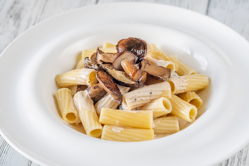 Tortiglioni pasta with porcini mushrooms and creamy sauce