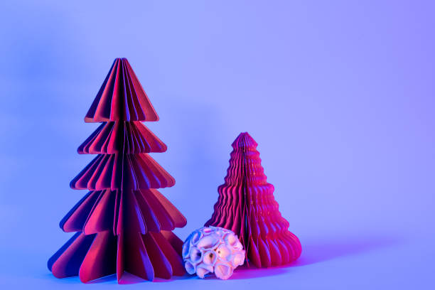 istock Decorative paper Christmas trees on blue background with trendy neon light. 1443520598