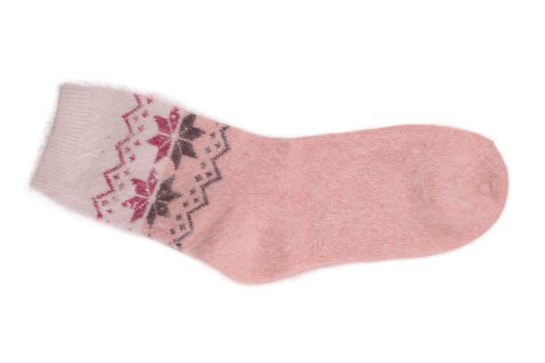 istock knitted warm wool socks, insulated on a white background 1443520639