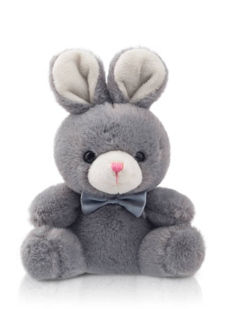 istock stuffed toy hare , fluffy rabbit with a bow, isolated 1443520644
