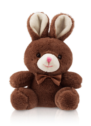 stuffed toy hare , fluffy rabbit with a bow, isolated