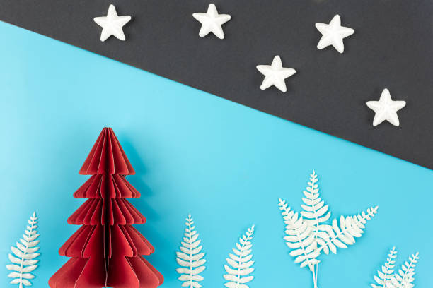 istock Christmas background with origami paper tree on paper background, flat lay. 1443521767