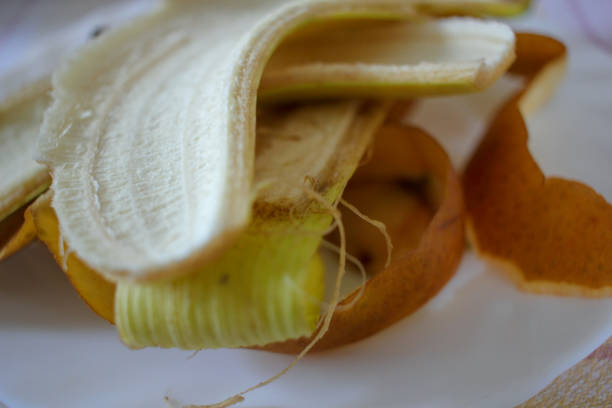 istock a plate full of skins from bananas and apples 1443522486