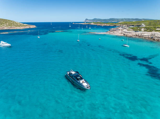 istock Luxury Motor Boat Anchored in Shallow Turquoise Waters 1443523135