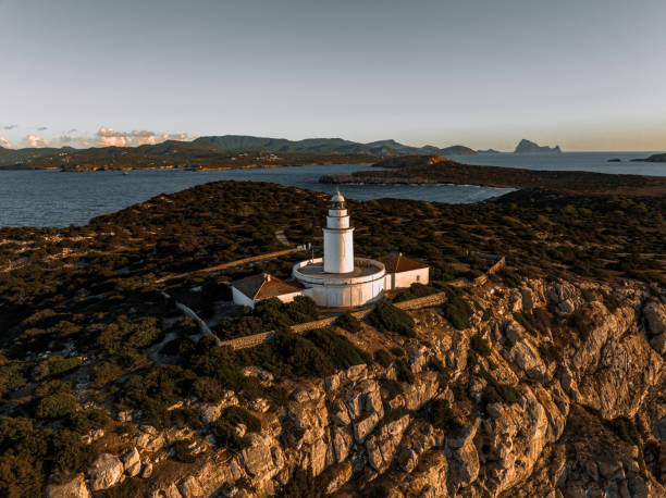 istock Lighthouse at Sunset on a Tall Cliff Overlooking the Mediterranean Sea 1443523287