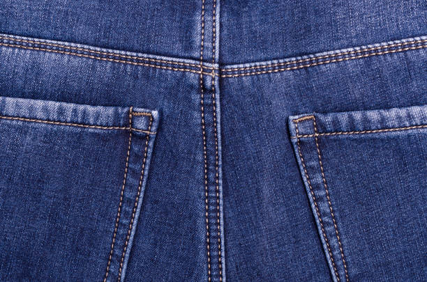 Part of blue jeans. Textile texture. Design concept. Top view.