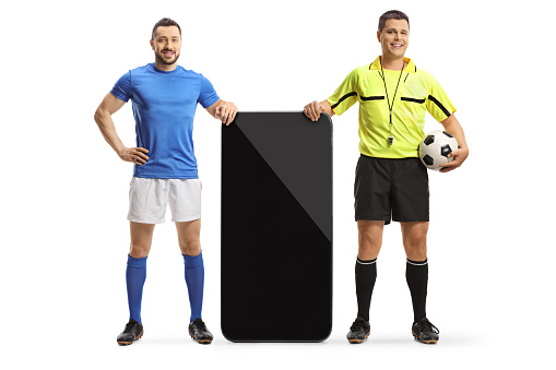 Referee and a football player leaning on a smartphone isolated on white background