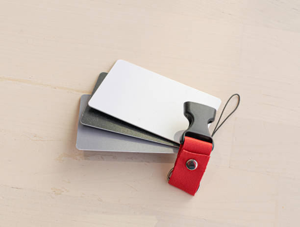 istock White balance cards on table, grey and black plastic cards, photographer tools 1443523749