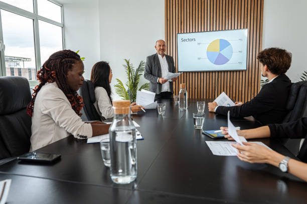 istock Business Meeting with Statistics Presentation 1443531285