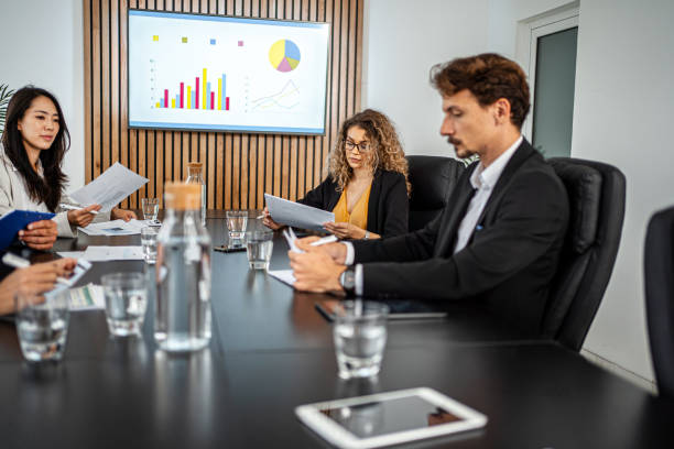 istock Business Meeting with Statistics Presentation 1443531393