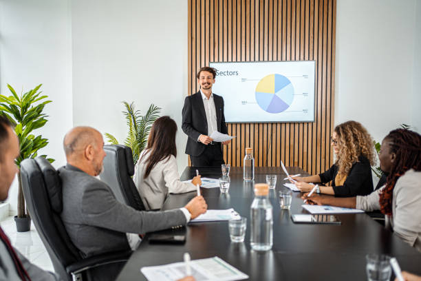 A business man giving a presentation at a meeting