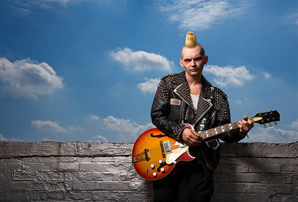 istock Punk male holding guitar. 144353245