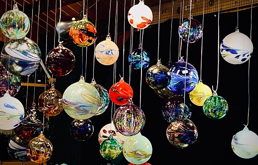 These beautiful Christmas and Hanukkah decorative ornaments hang from the ceiling