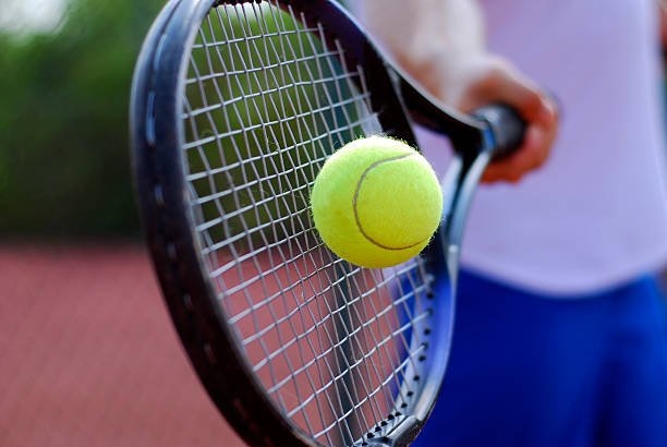 istock Tennis racket hitting a tennis ball 144353395