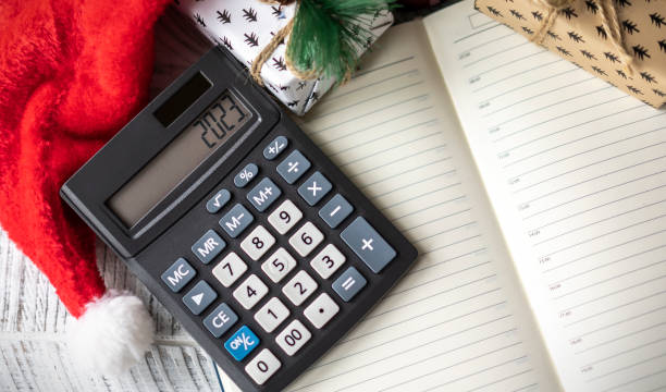 istock New Year's layout with calculator, Santa's hat and Christmas decorations 1443536201