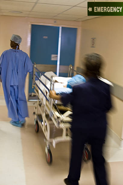 istock Hospital emergency with a patient being rushed 144353768