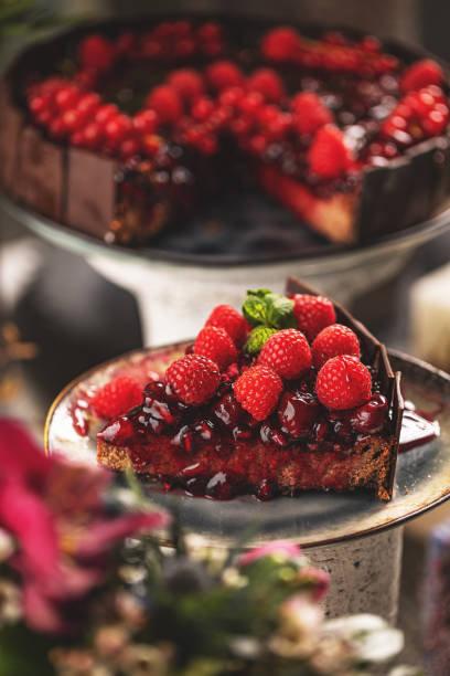 istock Slice of chocolate cake with cherry sauce 1443539481