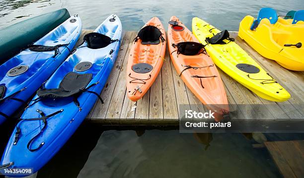 Kayaks And Canoes On The Dock Stock Photo - Download Image Now - Kayaking, Jetty, Kayak