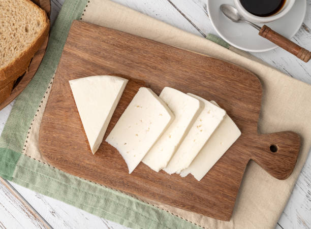istock Artisanal fresh Canastra cheese with bread over wooden board 1443541143