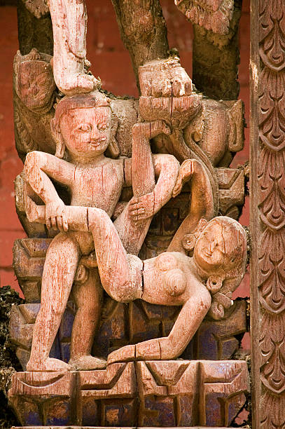 Nepalese erotic carving stock photo