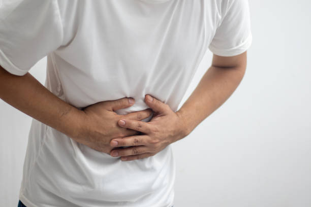 istock man having abdominal pain on white background 1443546295