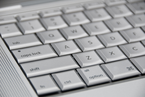 An angle shot of an aluminum color keyboard.