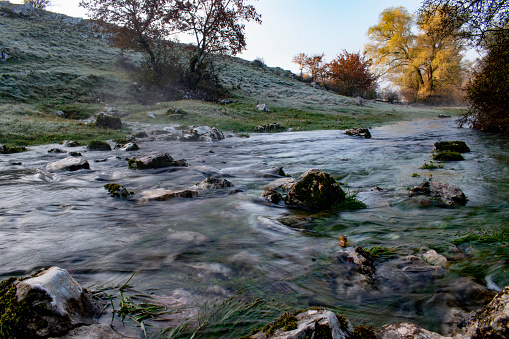 The beginning of the karst river in an autumn morning