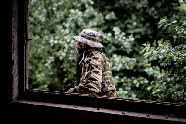 Army soldier passing by the window