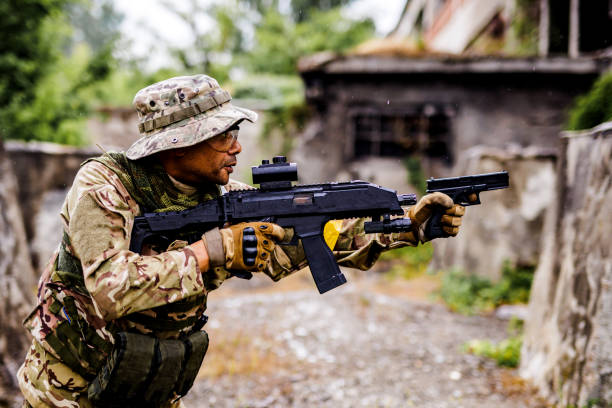 istock Army soldier with weapons searching for enemies 1443551391