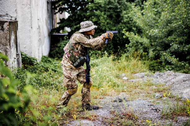 istock Army soldier searching battlefield with gun in his hands 1443551437