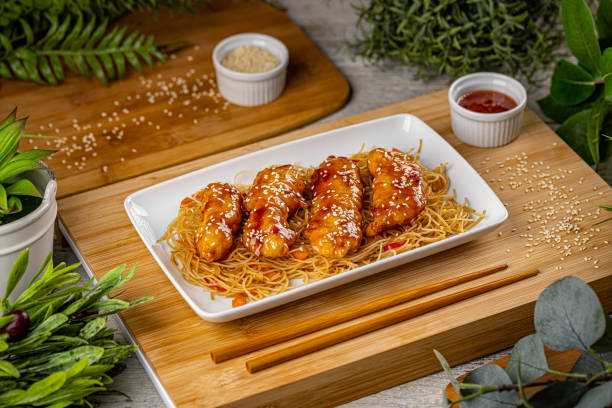 Caramelized chicken strips stock photo