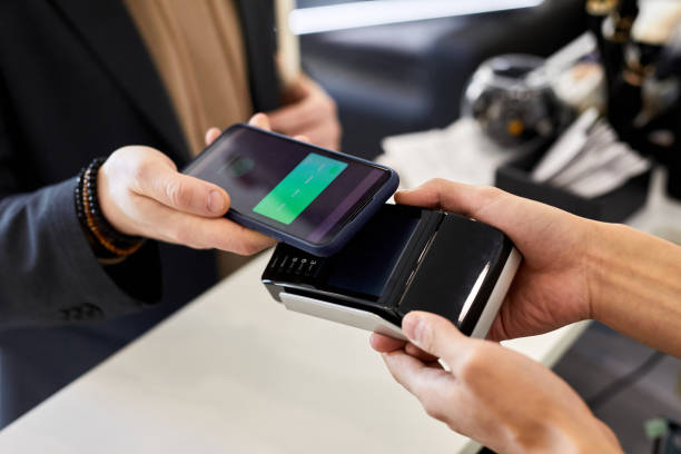 istock Close up of customer holding smartphone 1443552421