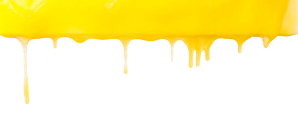 istock Yellow dripping honey on a white background, close-up border. 1443552550