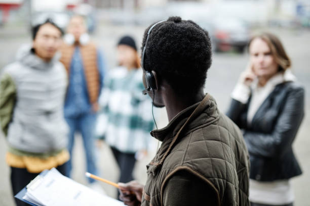 istock Back view of auctioneer wearing headset 1443554592