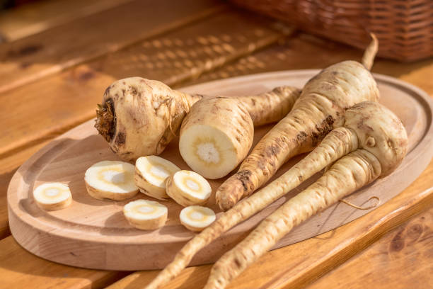 istock parsnip - sliced parsnip bulb on a cutting board 1443554609