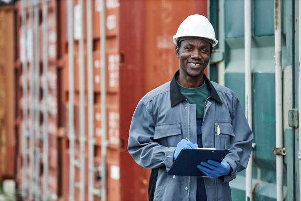 istock Worker wearing hardhat at shipping docks 1443554723