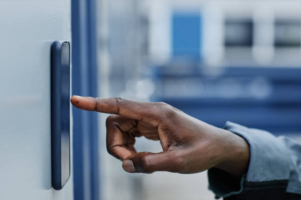 istock Closeup of male hand entering key code on door 1443555916