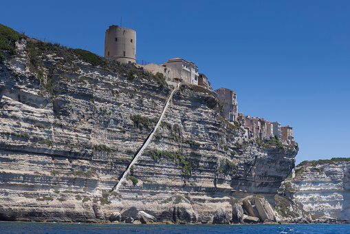 staircase of King of Aragon, a stony staircase carved into the vertical side of a limestone cliff, at the Corsican village of Bonifacio; Bonifacio, France