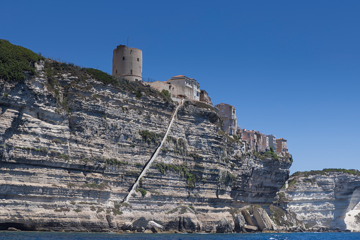 staircase of King of Aragon, a stony staircase carved into the vertical side of a limestone cliff, at the Corsican village of Bonifacio; Bonifacio, France