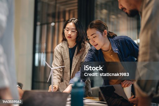 istock Asian architects team talking about a new project in the office. 1443559562
