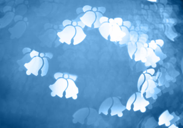 Defocused Christmas background with jingle bell.