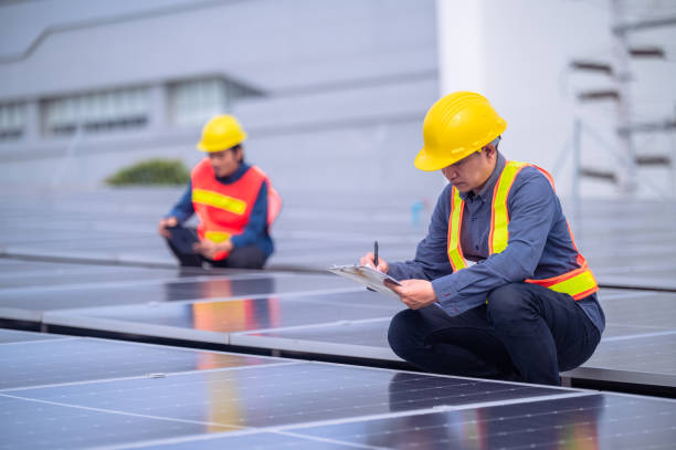 istock Team Asian Engineer inspecting quality of solar power solar cell energy system on rooftop of factory. 1443567430
