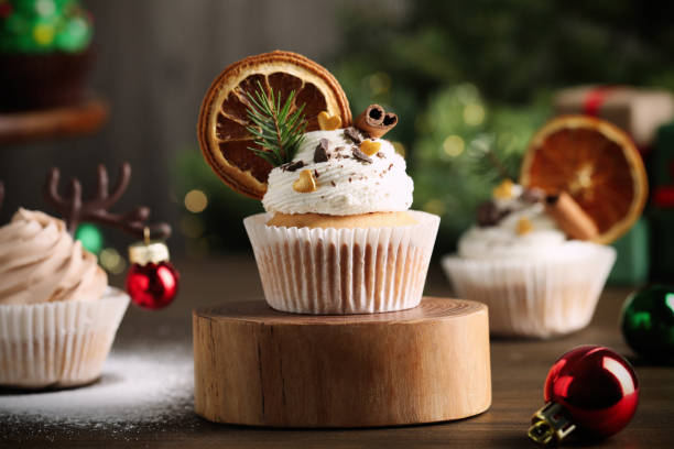istock Delicious cupcakes and Christmas decor on wooden table 1443567494