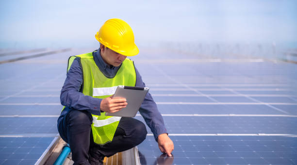 istock Asian Engineer checking solar power cell energy on rooftop of factory. 1443567566