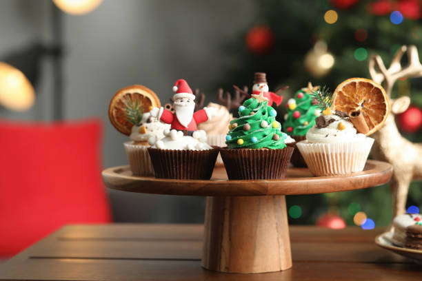 istock Many different Christmas cupcakes on wooden table indoors 1443568595