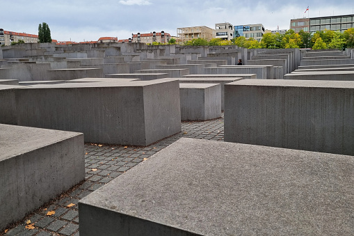 Berlin, Germany - Sept 2022: Concrete blocks of the Holocaust Memorial near Brandenburg Gate in Berlin Mitte