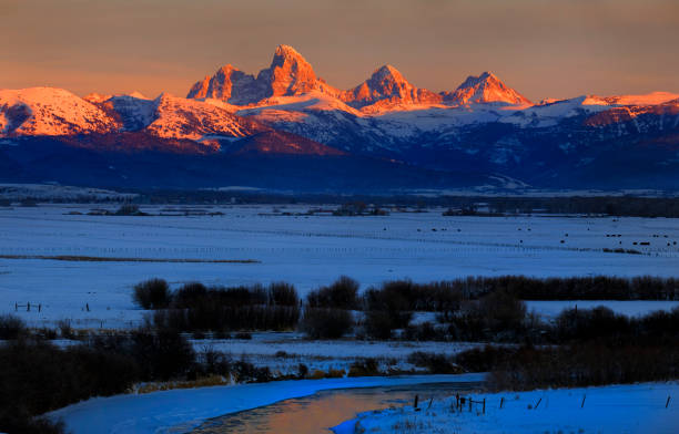 istock Tetons Teton Mountains in Winter Snow and Trees with Reflection in River 1443570281